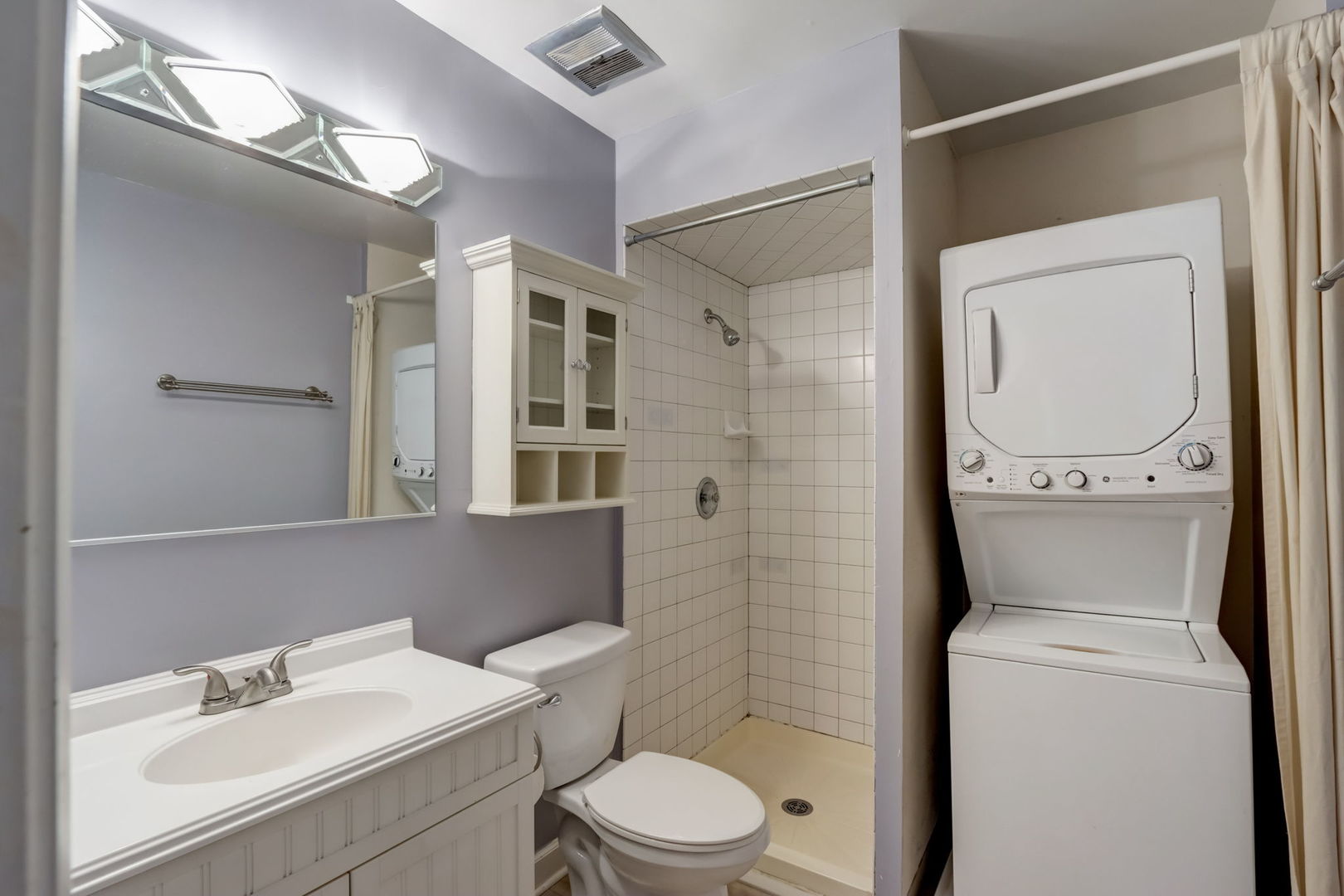 550 East Main Street, Unit 2E Barrington, IL 60010 - Photo 9 of 19 a bathroom with a toilet sink and mirror