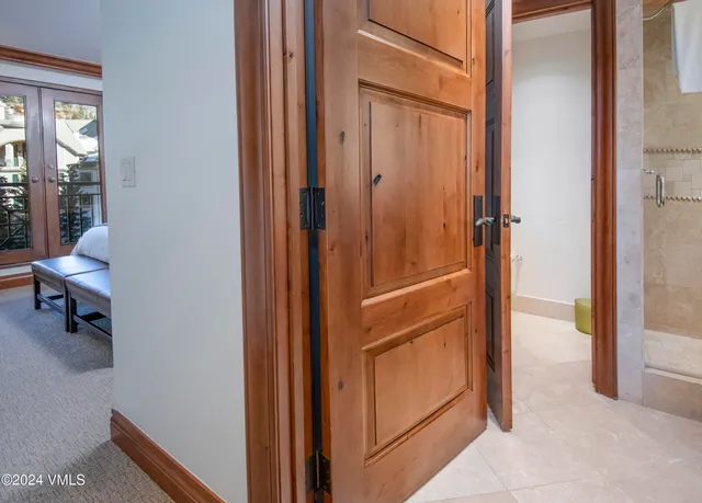 a hallway with furniture and a hallway