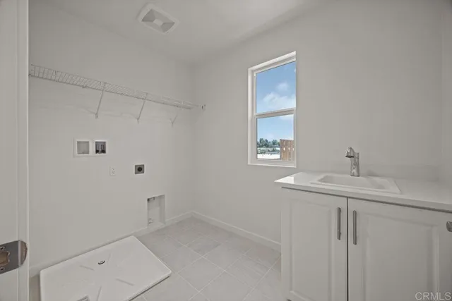 a bathroom with a sink a toilet and window