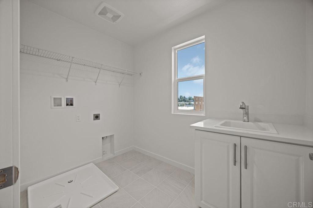 740 Kingbird Loop Oceanside, CA 92058 - Photo 12 of 23 a bathroom with a sink a toilet and window