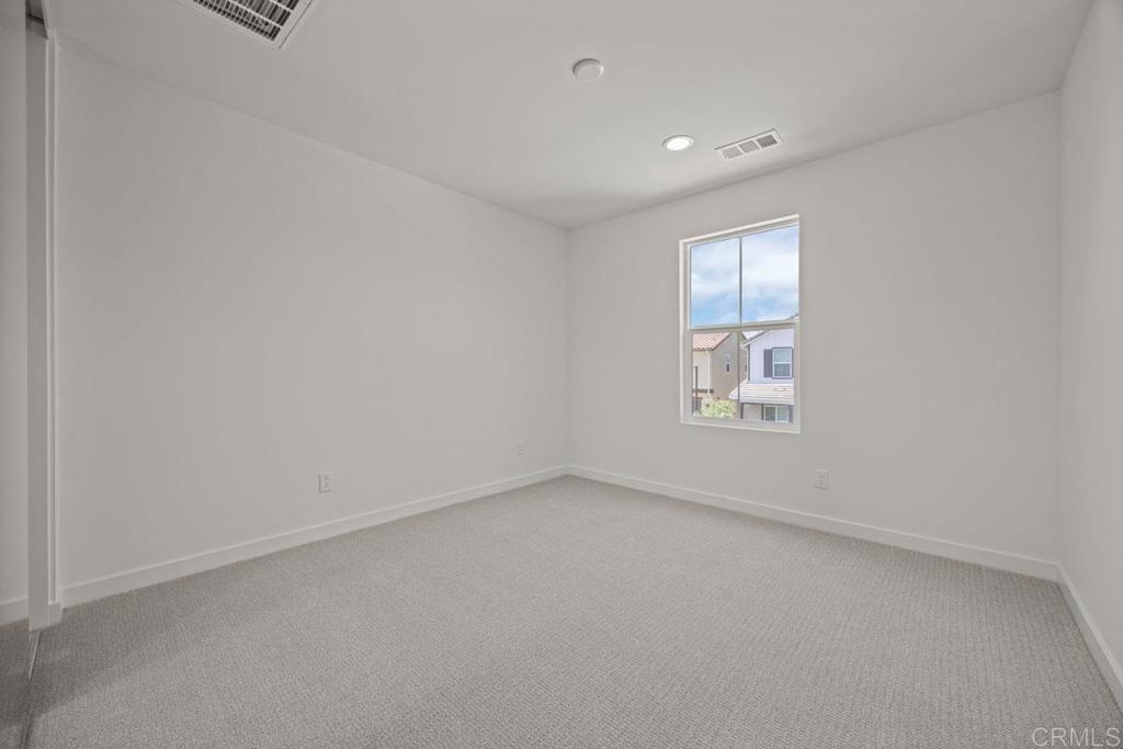 740 Kingbird Loop Oceanside, CA 92058 - Photo 13 of 23 an empty room with a window