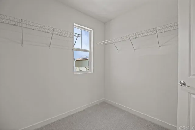 a view of a hallway with stairs