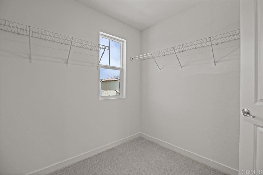 740 Kingbird Loop Oceanside, CA 92058 - Photo 17 of 23 a view of a room with racks on the wall