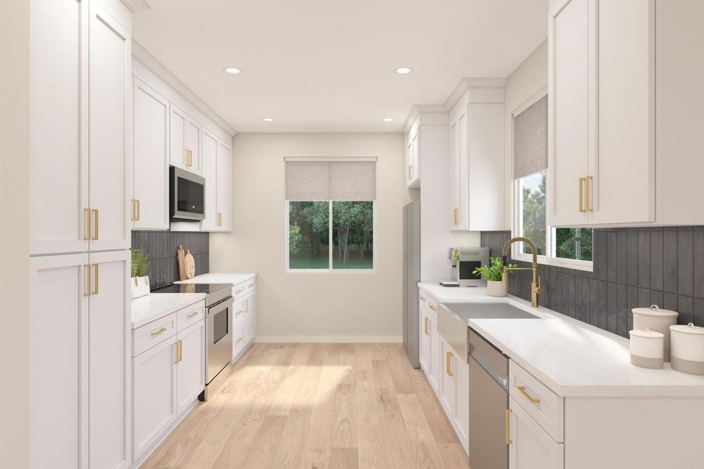 740 Kingbird Loop Oceanside, CA 92058 - Photo 3 of 23 a large white kitchen with a window