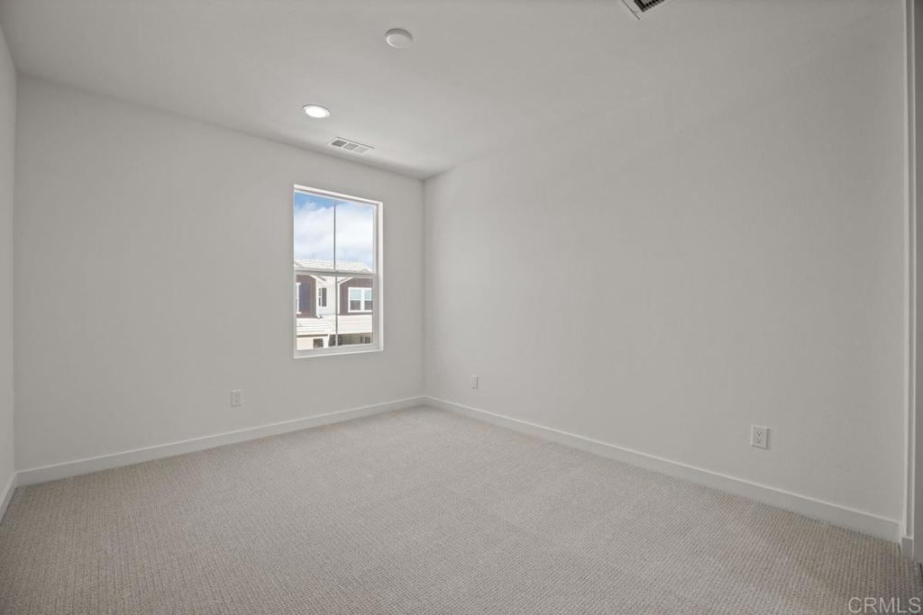 740 Kingbird Loop Oceanside, CA 92058 - Photo 10 of 23 an empty room with a window