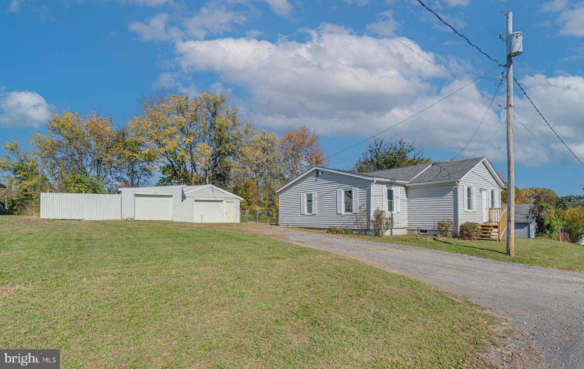 56 Clems Drive Ranson, WV 25438 - Photo 1 of 25 a view of a house with a yard