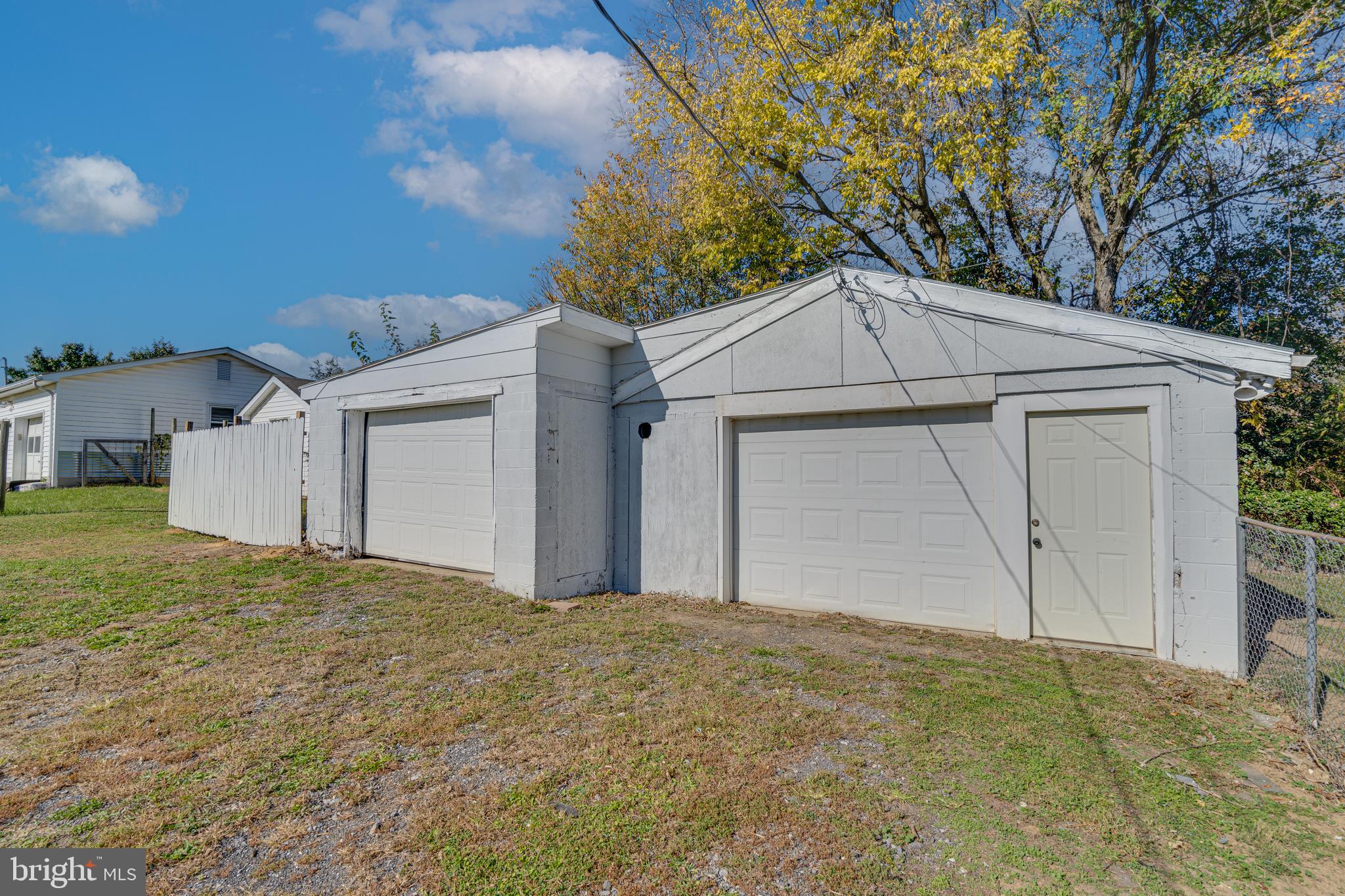 56 Clems Drive Ranson, WV 25438 - Photo 2 of 25 a house with white door of garage
