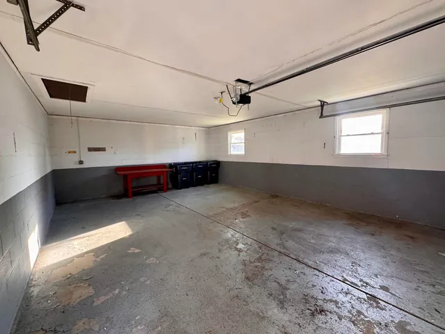 a view of storage and utility room with window