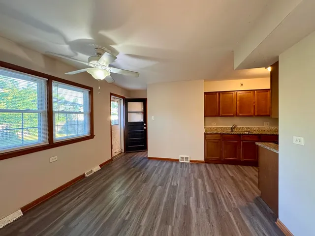 a view of kitchen with stove and microwave