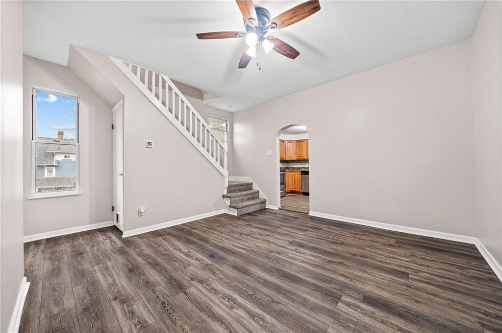 145 Lawrence Avenue Washington, PA 15301 - Photo 11 of 32 a view of empty room with wooden floor and fan