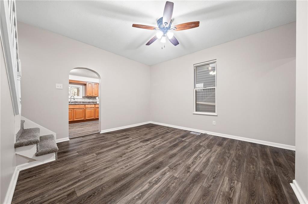 145 Lawrence Avenue Washington, PA 15301 - Photo 12 of 32 a view of empty room with wooden floor and fan