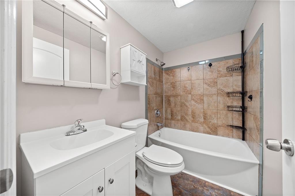 145 Lawrence Avenue Washington, PA 15301 - Photo 17 of 32 a bathroom with a sink a toilet and bathtub
