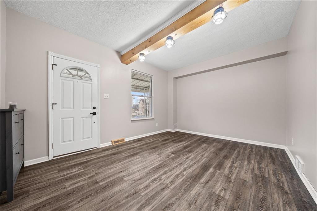 145 Lawrence Avenue Washington, PA 15301 - Photo 3 of 32 wooden floor in an empty room with a window