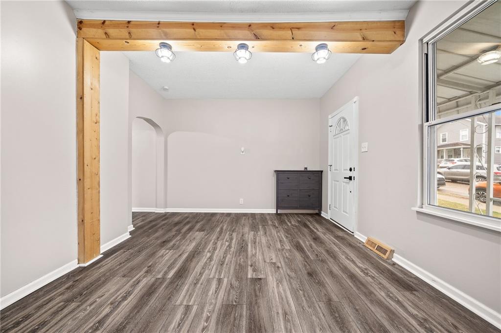 145 Lawrence Avenue Washington, PA 15301 - Photo 4 of 32 a view of a room with wooden floor and brick walls