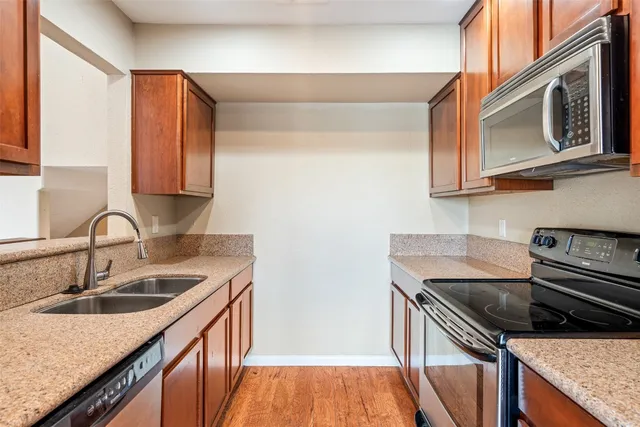 a kitchen that has a sink and a stove
