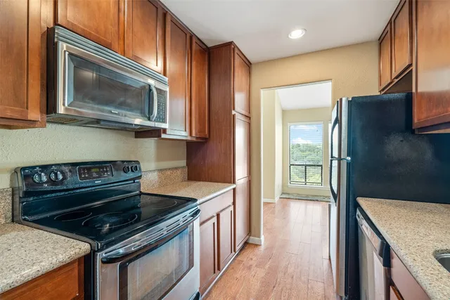 a kitchen with a stove and a microwave