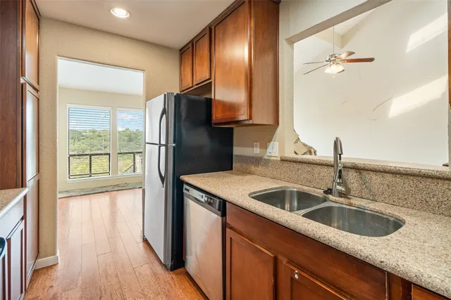 a kitchen with a sink and a refrigerator