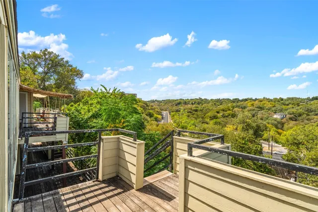 a view of a balcony with an ocean view