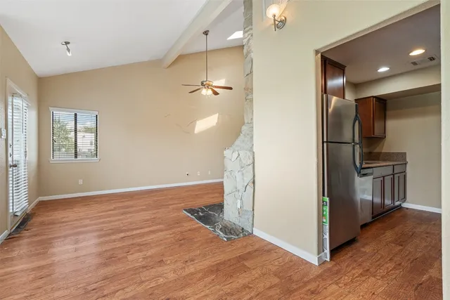 a view of a kitchen cabinets and wooden floor