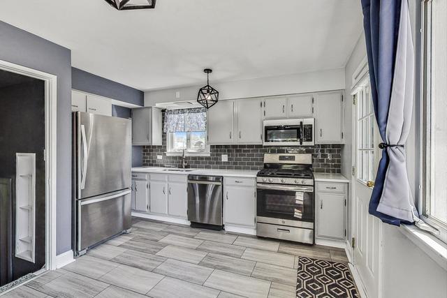 509 North Willow Road Elmhurst, IL 60126 - Photo 2 of 17 a kitchen with stainless steel appliances granite countertop a refrigerator stove and sink