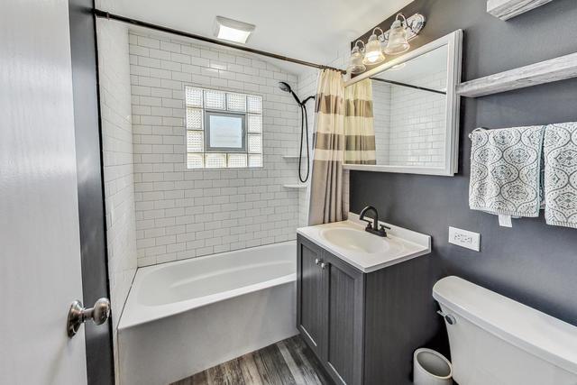 509 North Willow Road Elmhurst, IL 60126 - Photo 8 of 17 a bathroom with a sink toilet and shower