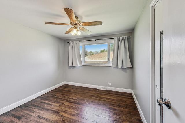 509 North Willow Road Elmhurst, IL 60126 - Photo 10 of 17 a view of an empty room with wooden floor and a window