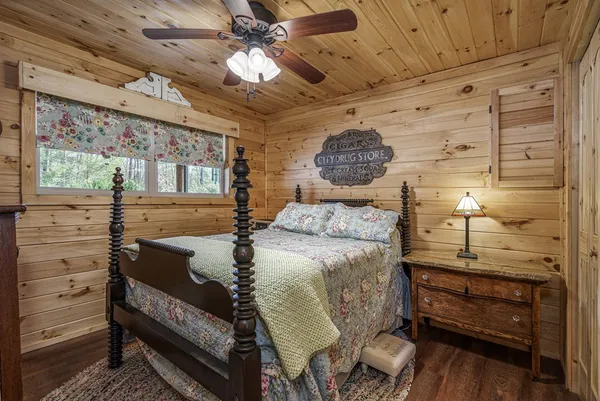 a bedroom with a bed and a mirror