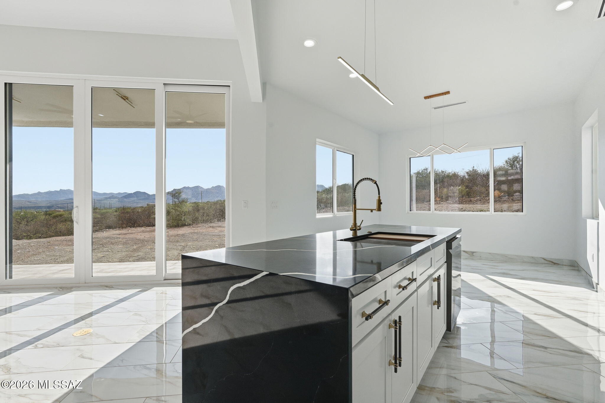1786 Peralta Court Rio Rico, AZ 85648 - Photo 14 of 50 a kitchen with granite countertop a sink and a stove