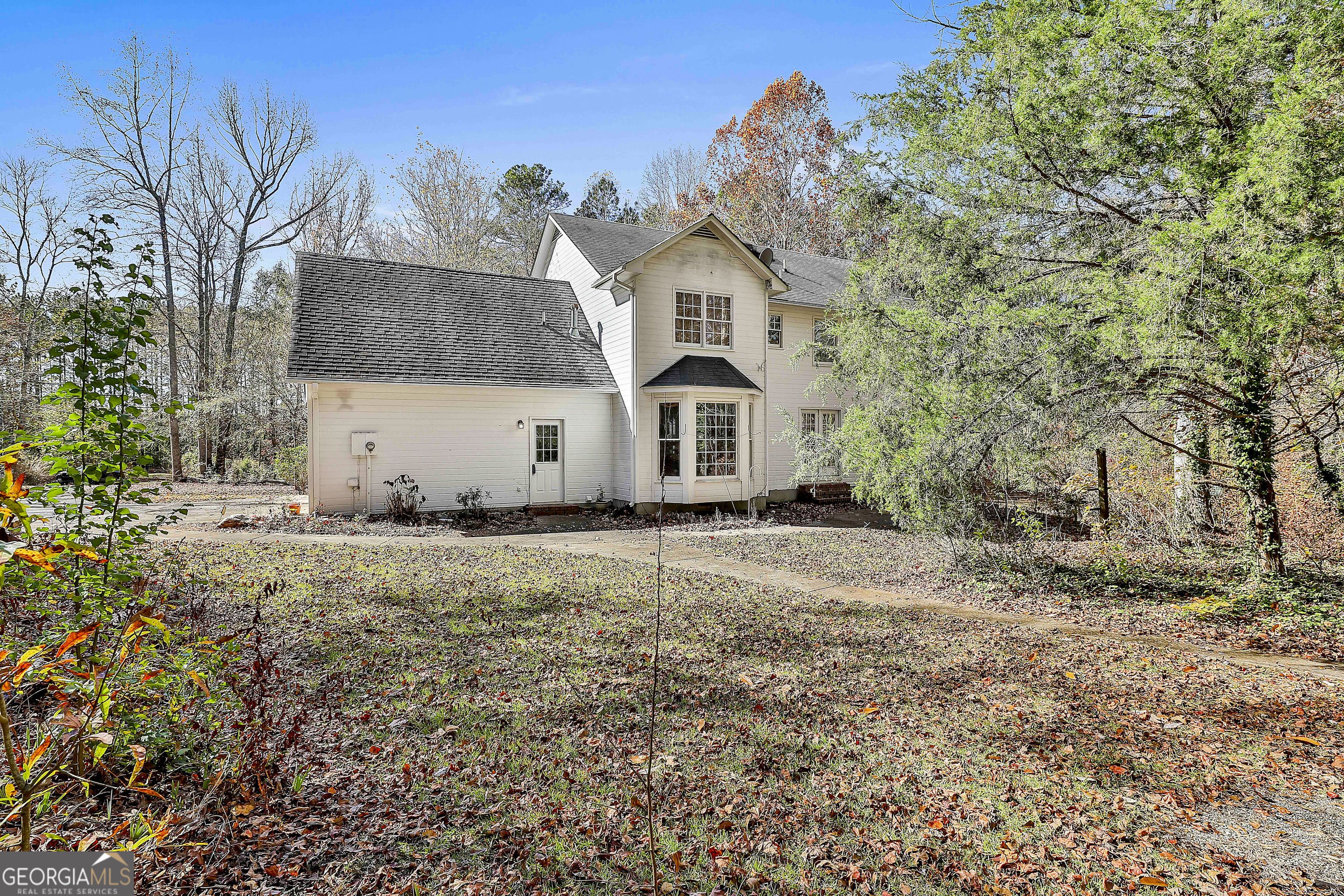 2246 Concord Road Concord, GA 30206 - Photo 15 of 18 a view of a white house with a yard