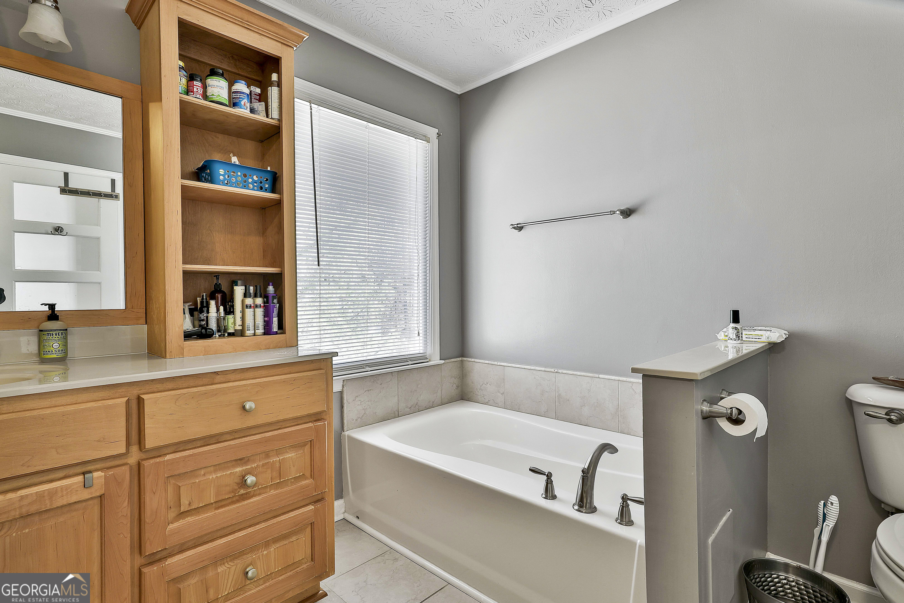 2246 Concord Road Concord, GA 30206 - Photo 18 of 18 a bathroom with a tub sink and mirror