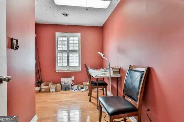 a workspace with furniture and window