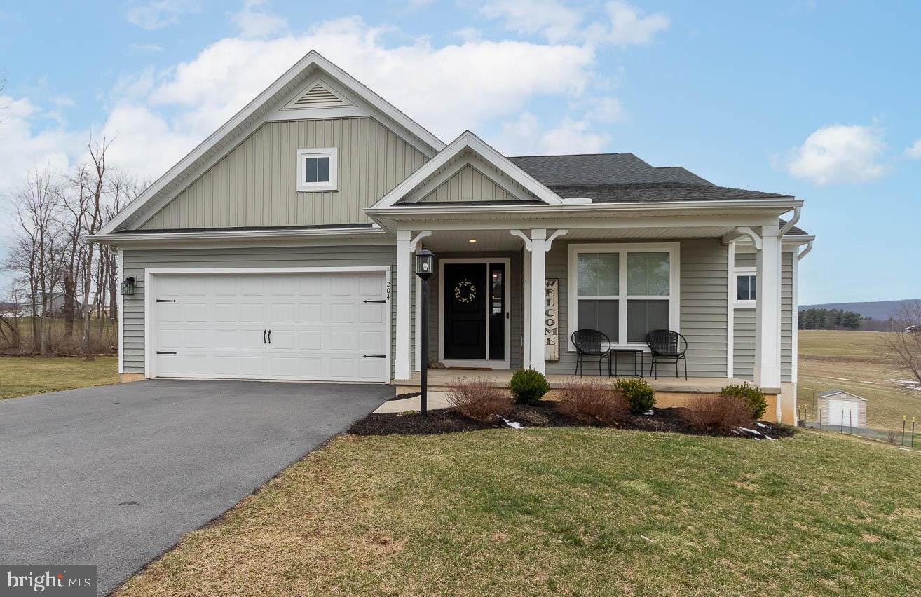 204 Whitetail Circle Mill Hall, PA 17751 - Photo 1 of 33 a front view of a house with a yard and garage