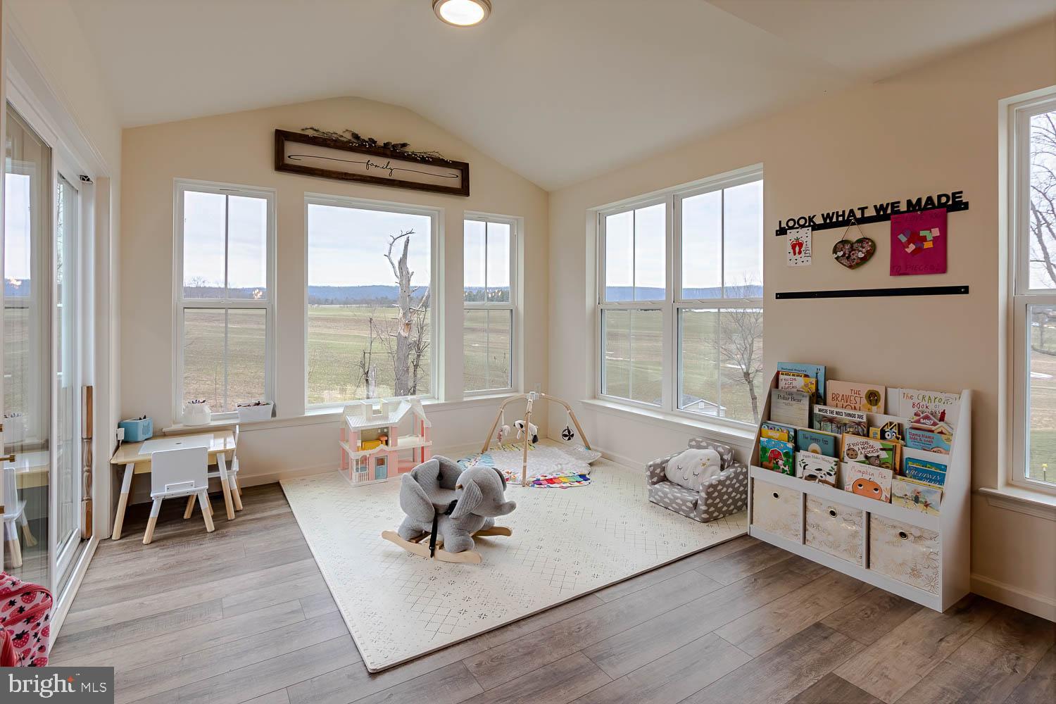 204 Whitetail Circle Mill Hall, PA 17751 - Photo 12 of 33 a living room with furniture hard wood floor and a floor to ceiling window