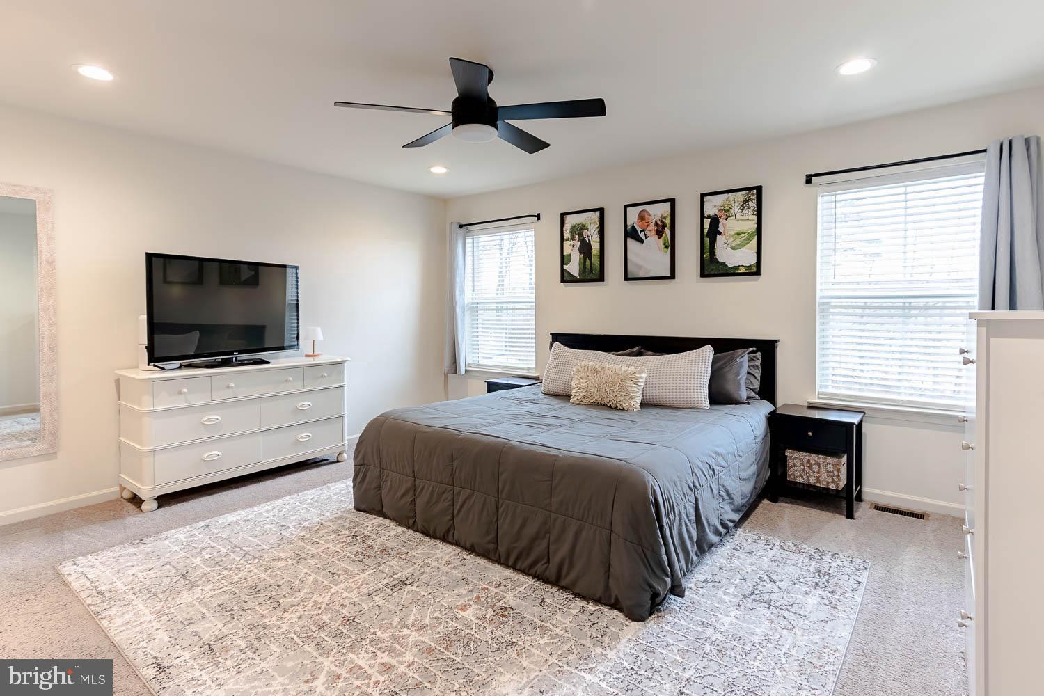 204 Whitetail Circle Mill Hall, PA 17751 - Photo 13 of 33 a bedroom with a bed a tv and wooden floor