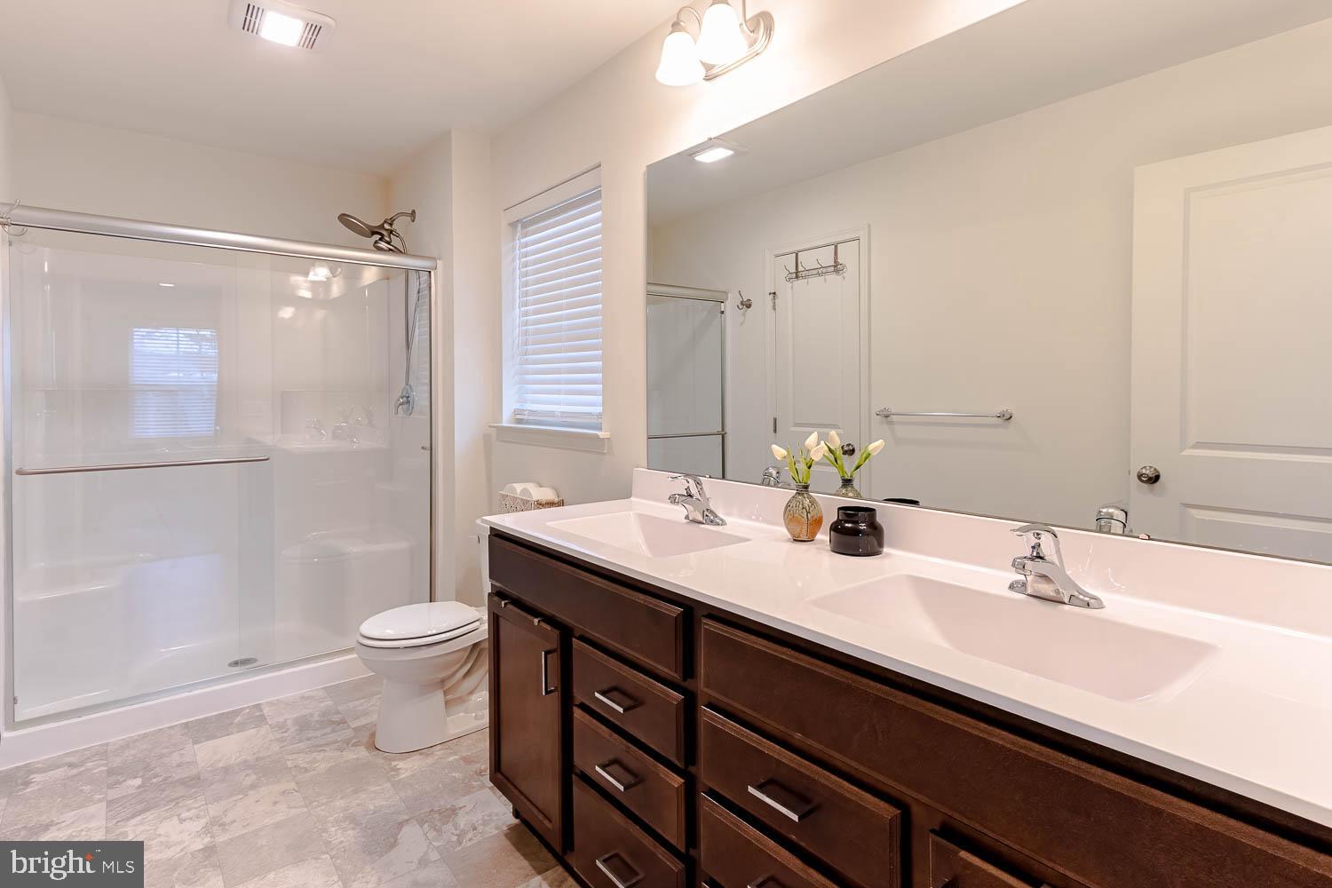 204 Whitetail Circle Mill Hall, PA 17751 - Photo 17 of 33 a bathroom with a double vanity sink toilet and shower