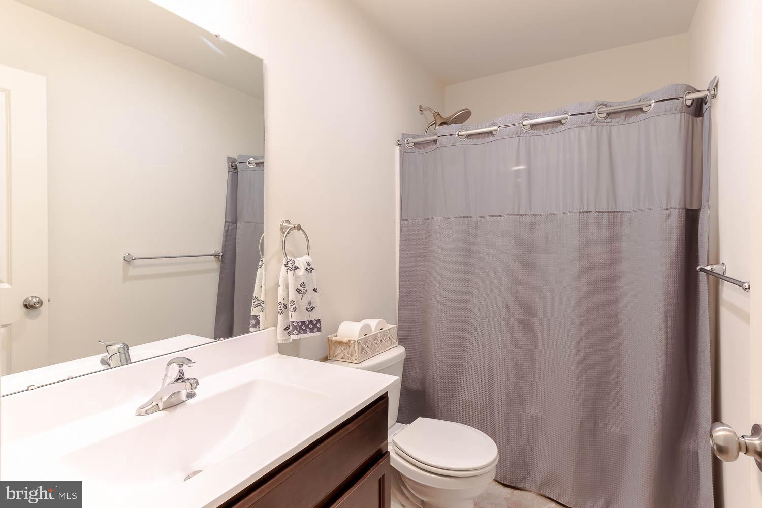 204 Whitetail Circle Mill Hall, PA 17751 - Photo 20 of 33 a bathroom with a sink a toilet a mirror and shower