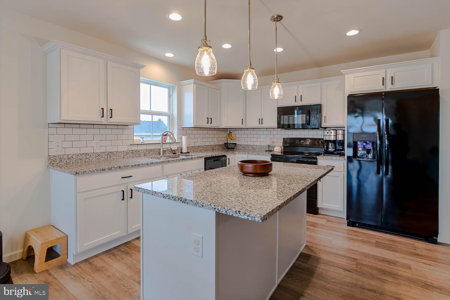 204 Whitetail Circle Mill Hall, PA 17751 - Photo 7 of 33 a kitchen with stainless steel appliances granite countertop a sink stove and refrigerator