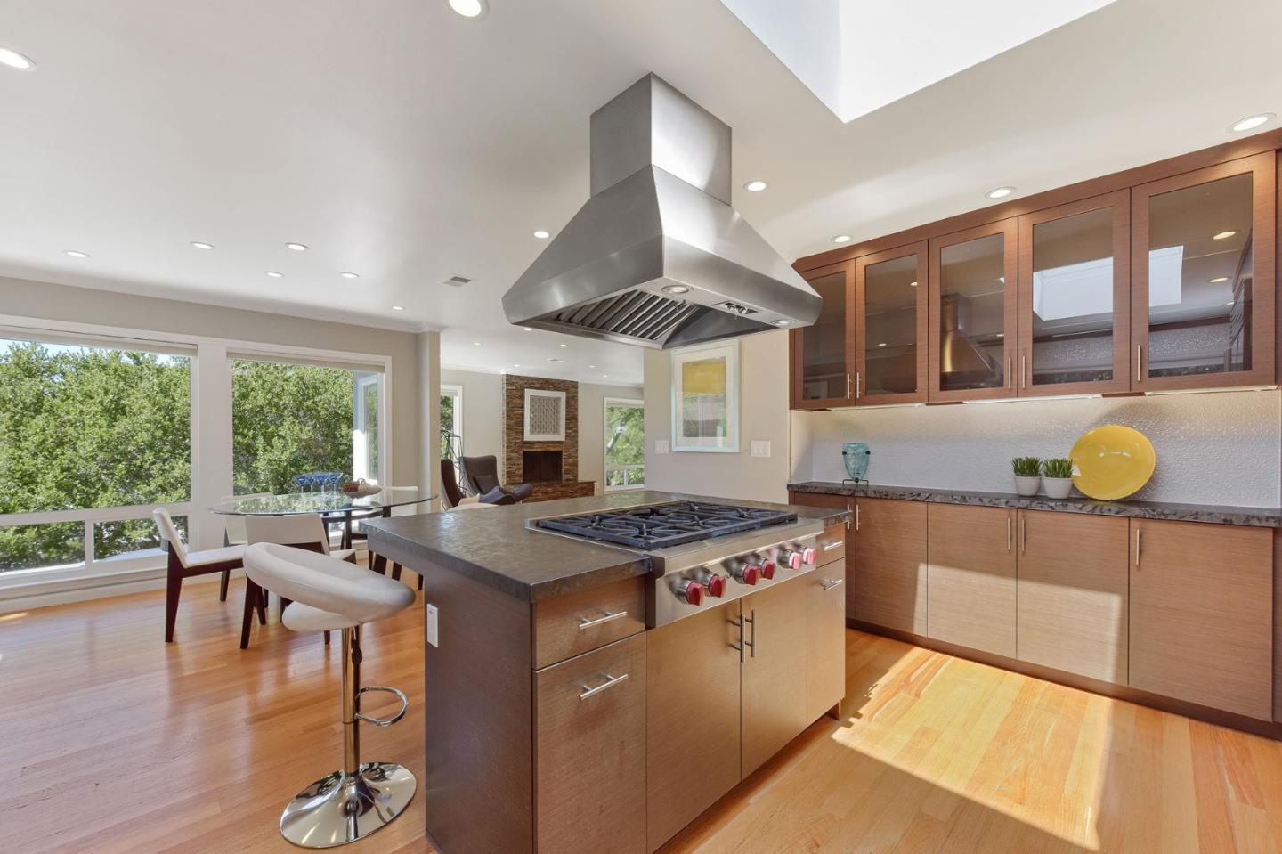 39 Colorados Drive Millbrae, CA 94030 - Photo 13 of 49 a kitchen that has a stove and a table in it
