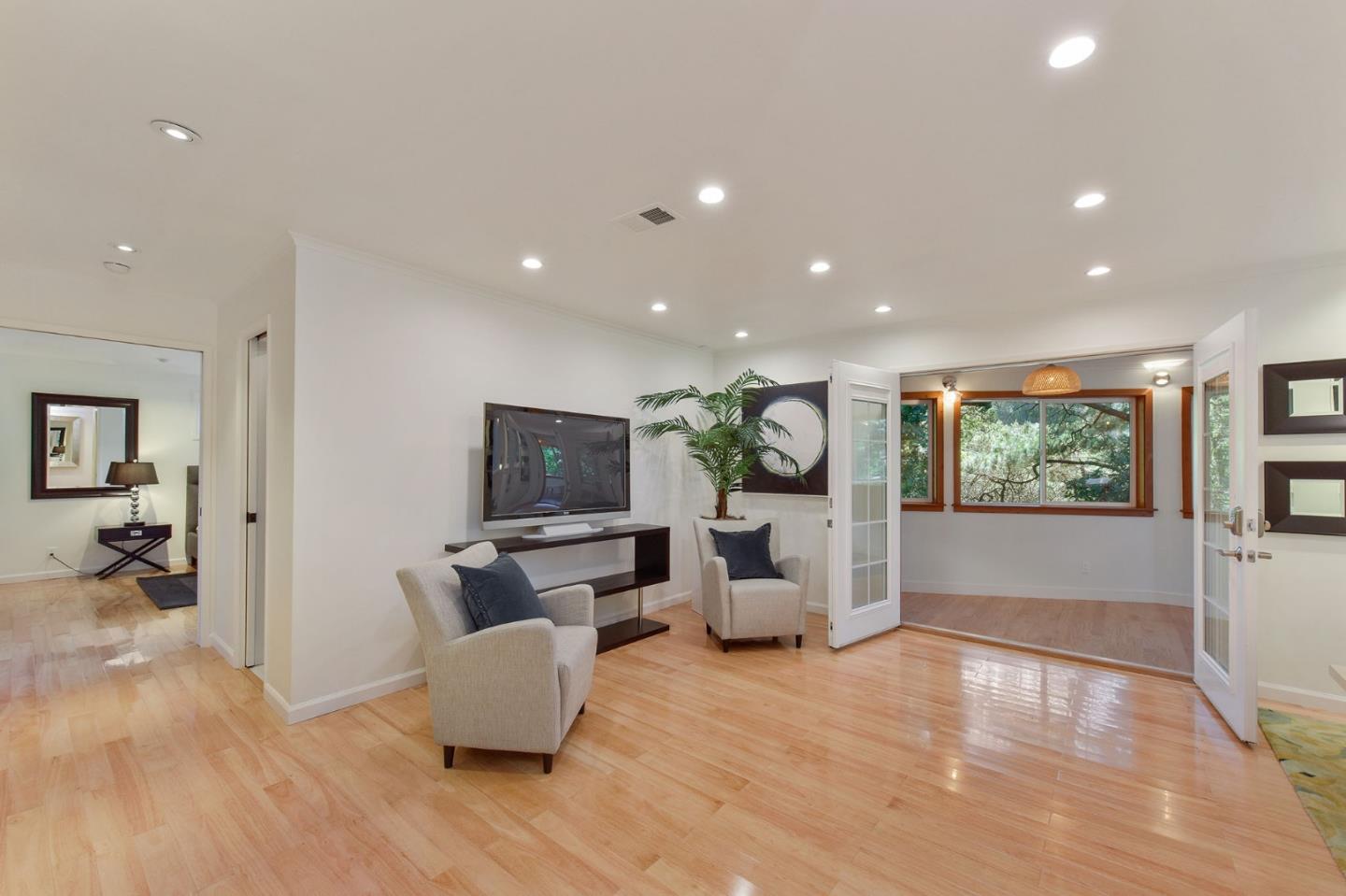39 Colorados Drive Millbrae, CA 94030 - Photo 16 of 49 a living room with furniture and a flat screen tv