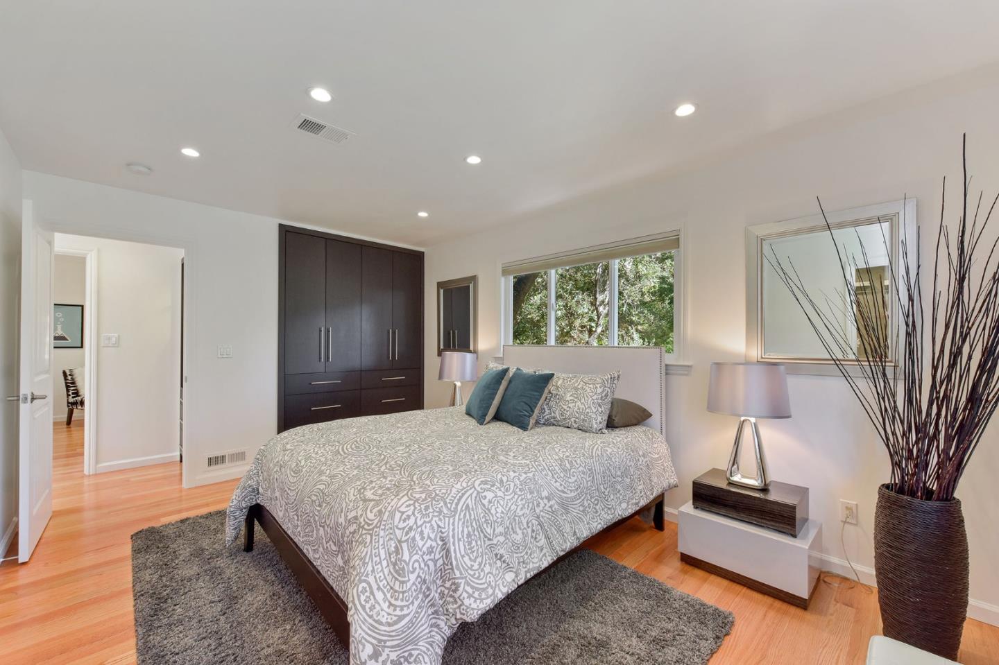 39 Colorados Drive Millbrae, CA 94030 - Photo 21 of 49 a bedroom with a bed and a night stand