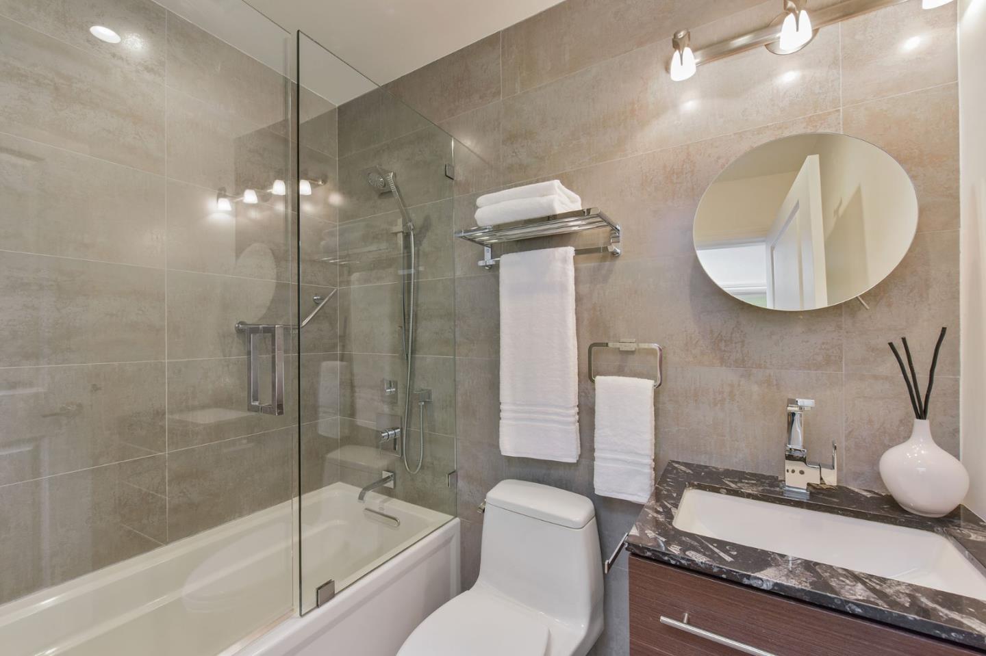 39 Colorados Drive Millbrae, CA 94030 - Photo 24 of 49 a bathroom with a granite countertop sink a toilet and bathtub
