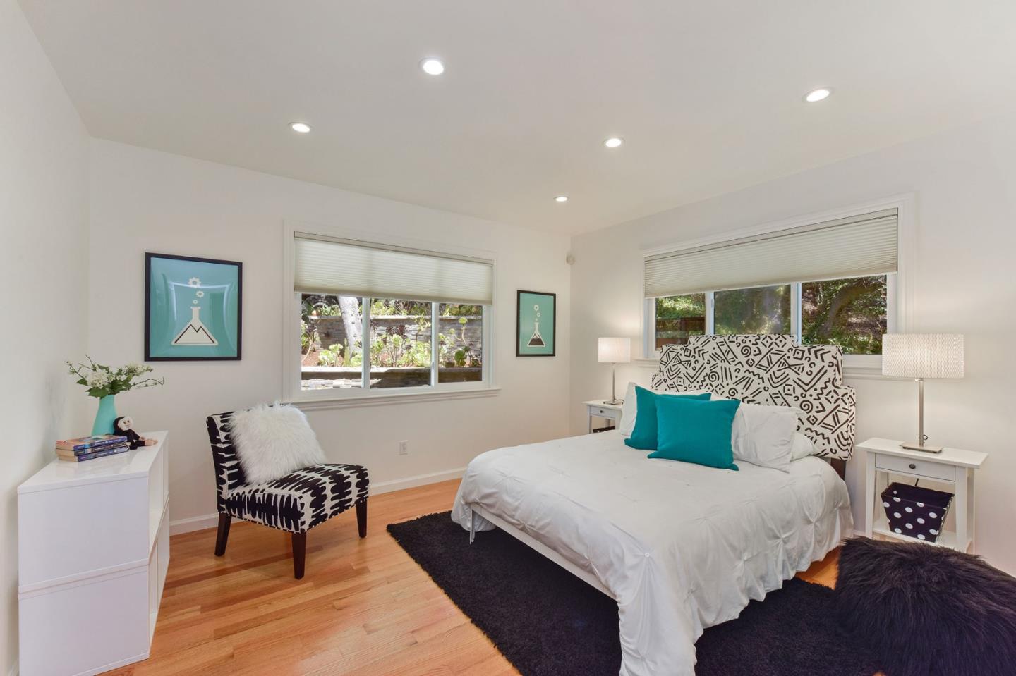 39 Colorados Drive Millbrae, CA 94030 - Photo 25 of 49 a bedroom with a large bed and a couch