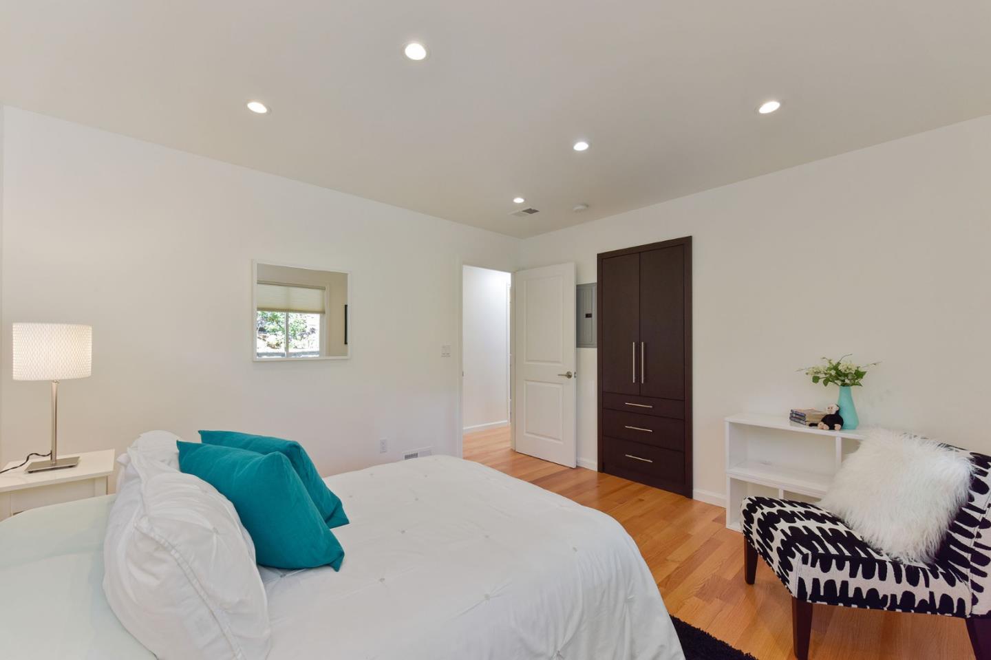 39 Colorados Drive Millbrae, CA 94030 - Photo 26 of 49 a bedroom with a bed and chair