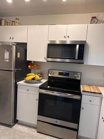 a kitchen with a stove and a microwave