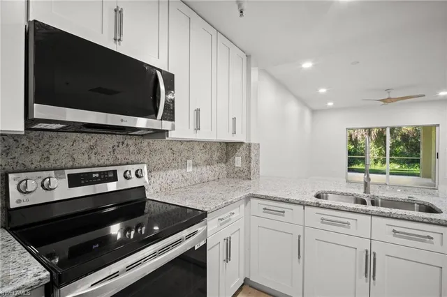 a kitchen with a stove and a microwave