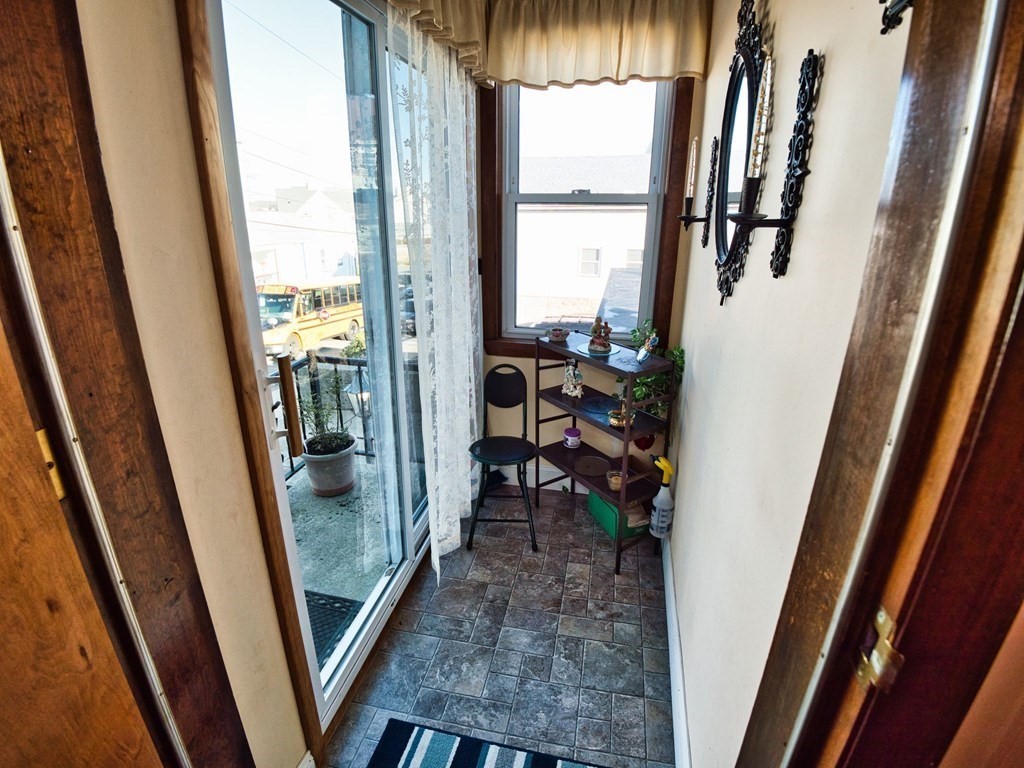 40 Howard Street Fall River, MA 02721 - Photo 11 of 31 a view of a livingroom with furniture and front door