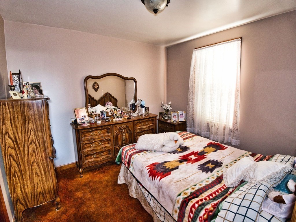 40 Howard Street Fall River, MA 02721 - Photo 15 of 31 a bedroom with a bed and a dresser