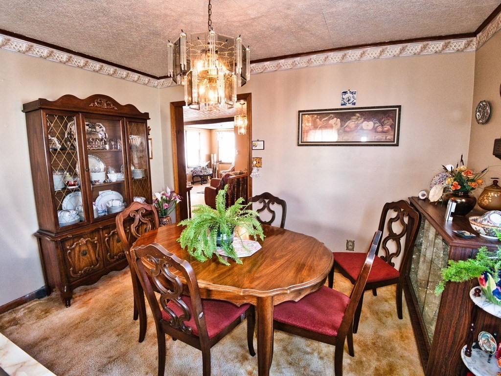 40 Howard Street Fall River, MA 02721 - Photo 17 of 31 a view of a dining room with furniture and chandelier