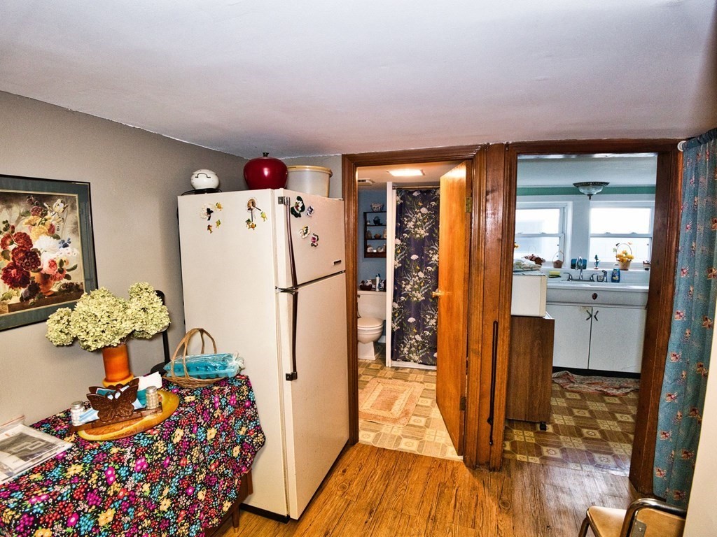 40 Howard Street Fall River, MA 02721 - Photo 29 of 31 a kitchen with stainless steel appliances granite countertop a refrigerator and a stove