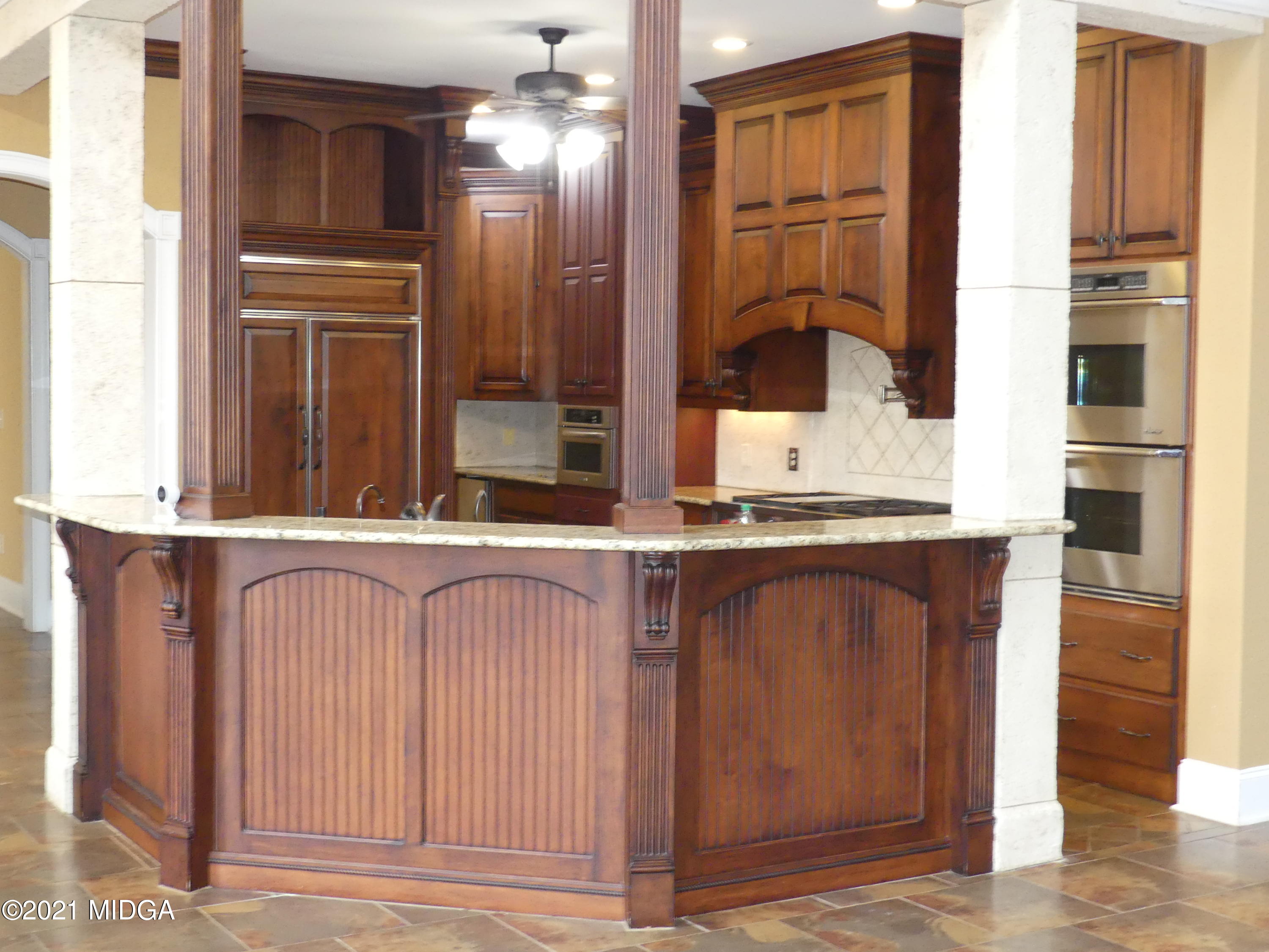 1616 Wadley Road Macon, GA 31220 - Photo 11 of 56 a view of kitchen with granite countertop cabinets and black stainless steel appliances